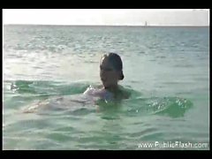 Chick at the beach has fun swimming