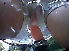 Asian cutie rides a dildo bike