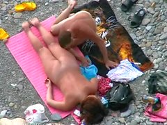 Voyeur clip of couple fucking on beach