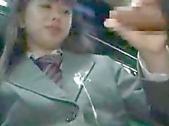 Schoolgirl gives handjob on a bus