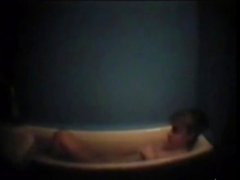 Busty mother masturbates in bath