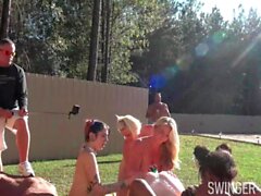 Horny babes licking and fucking toys in outdoor lesbian orgy