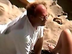 Man eats pussy in the beach