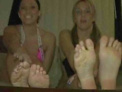 Two pretty girls show their feet