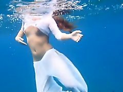 Julia swimming nude in the sea