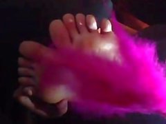 Guy tickles his girlfriends feet in car