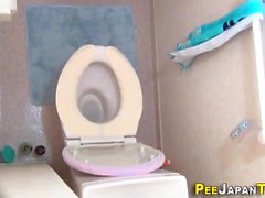 Asian teen pees in toilet