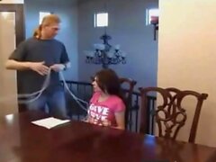 Bound and tape gagged slut gets fucked on the table