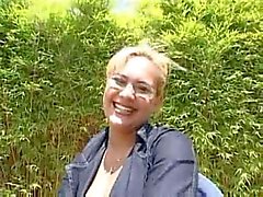 Mature in glasses laid outdoors