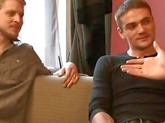 Two sexy gay friends are talking before kissing